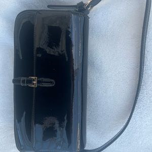 Black patent leather bag.